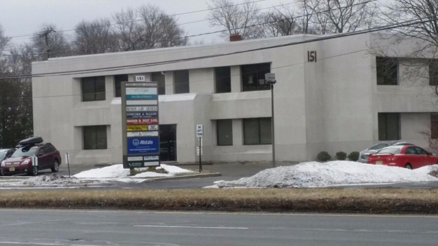 Photo of Cindy Donaldson: Allstate Insurance with customers to explain their policy coverage