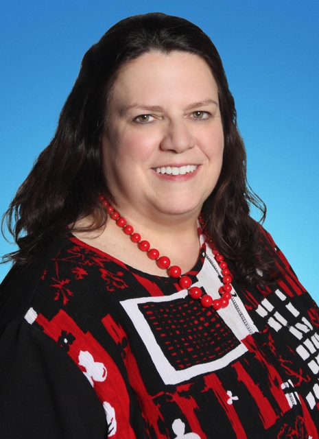 Photo of Cindy Donaldson: Allstate Insurance with customers to explain their policy coverage