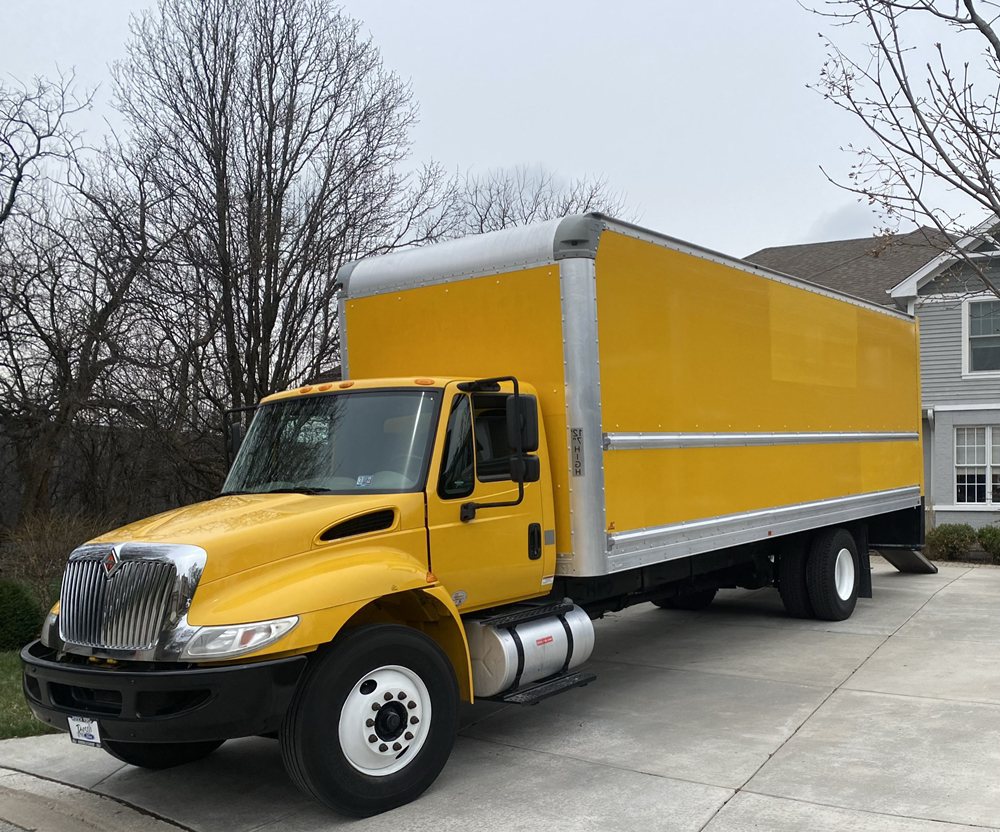 Photo of Yellow Truck Moving and Junk Hauling