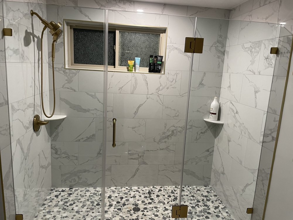 Photo of Artistic shower door glass railings