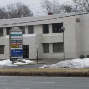Photo of Cindy Donaldson: Allstate Insurance with customers to explain their policy coverage