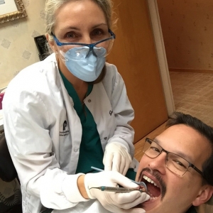 Photo of Pi Dental Center Providing Our Dental Patients