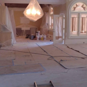 Photo of Zelaya painting and pressure washing