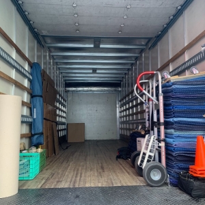 Photo of Muscular Moving Men and Storage